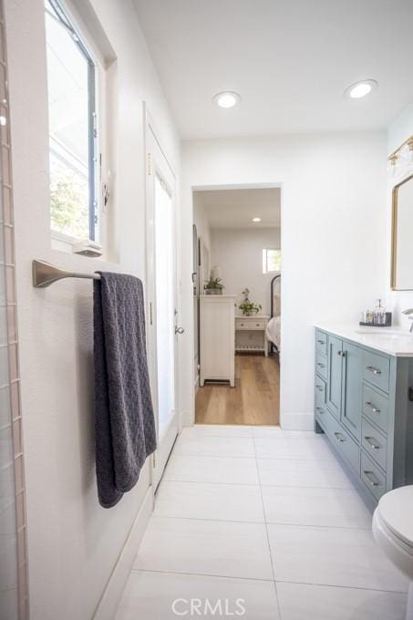 full bathroom with recessed lighting, tile patterned floors, ensuite bath, and vanity