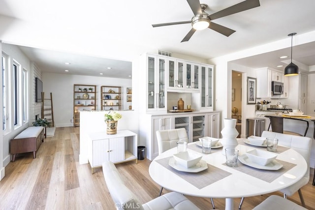 dining room featuring recessed lighting, visible vents, ceiling fan, and light wood-style flooring