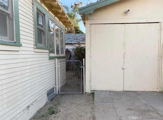 exterior space with a gate and fence