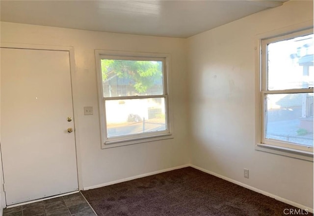 interior space featuring baseboards