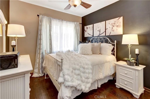 bedroom featuring ceiling fan and dark wood-style flooring