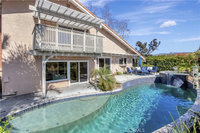 outdoor pool with a patio, an outdoor hangout area, and an in ground hot tub