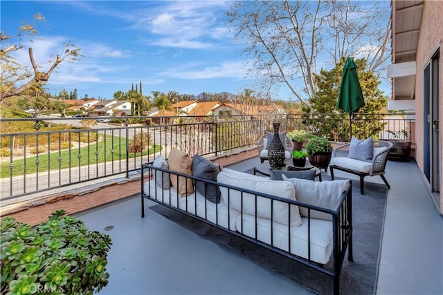 view of patio with a residential view and an outdoor living space