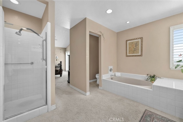 bathroom with a garden tub, recessed lighting, toilet, a stall shower, and baseboards