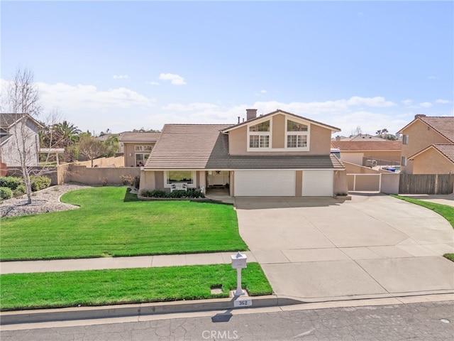 mid-century home with concrete driveway, fence, a tiled roof, and an attached garage