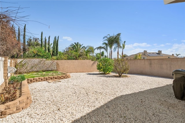 view of yard with a patio area and a fenced backyard