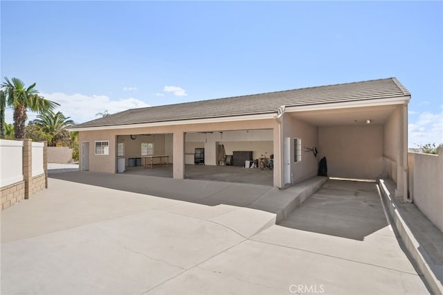 detached garage featuring fence