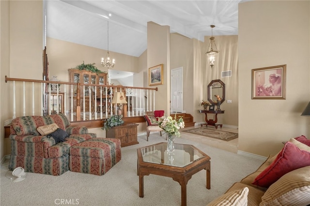 carpeted living area featuring a chandelier, visible vents, baseboards, stairs, and beam ceiling