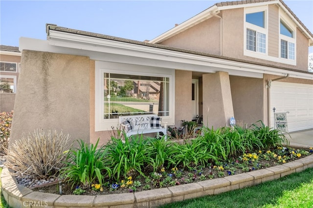 view of front of home with a porch and stucco siding