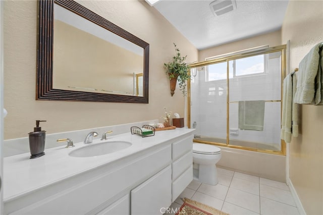 bathroom featuring enclosed tub / shower combo, a textured ceiling, tile patterned flooring, toilet, and vanity