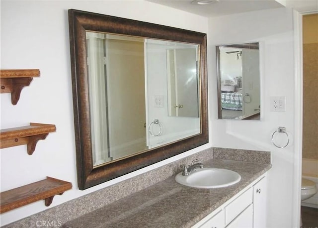 bathroom with vanity and toilet