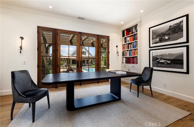 office with french doors, ornamental molding, wood finished floors, and baseboards