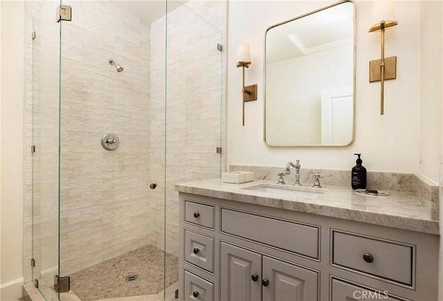 full bath featuring a stall shower and vanity