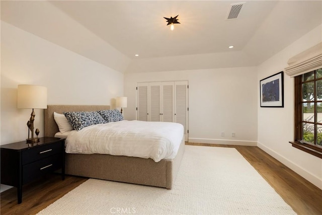 bedroom featuring baseboards, visible vents, dark wood-style flooring, vaulted ceiling, and recessed lighting