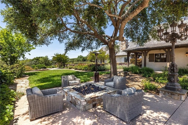 view of patio with an outdoor fire pit