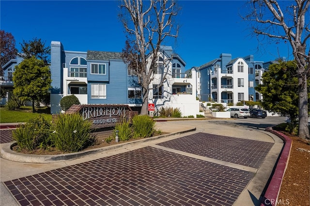 exterior space with a residential view and curbs