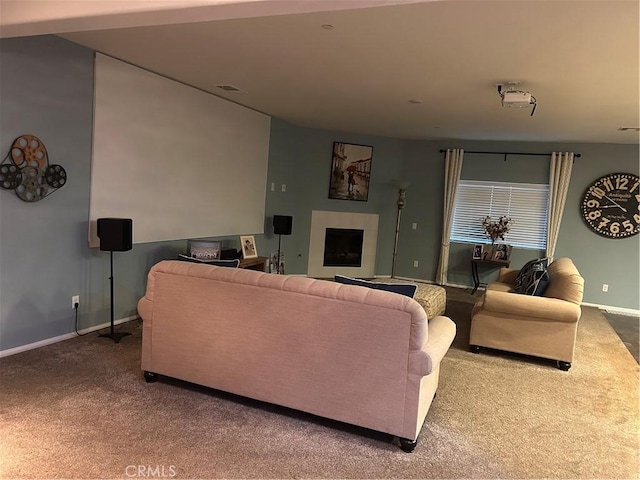 carpeted living room with a fireplace and baseboards