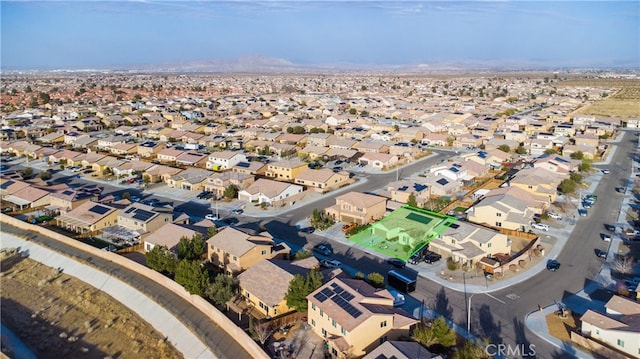 drone / aerial view with a residential view and a mountain view