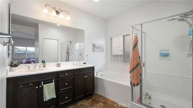 full bathroom featuring a sink, a shower stall, and a bath