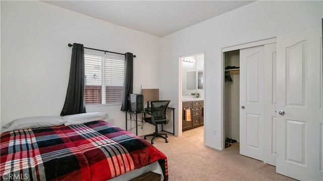 bedroom featuring ensuite bath, a closet, and carpet flooring