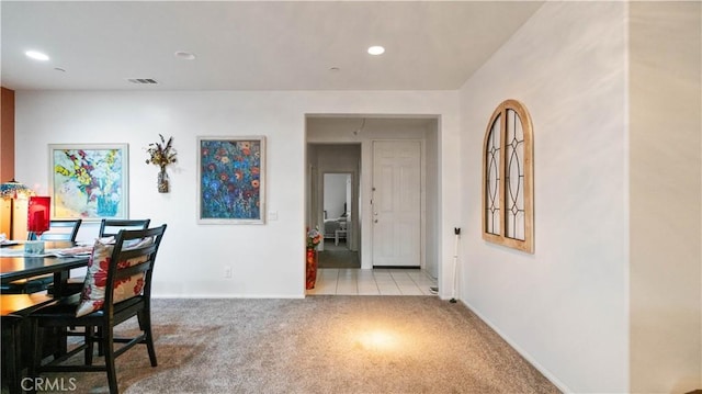 dining space with recessed lighting, visible vents, baseboards, and light colored carpet