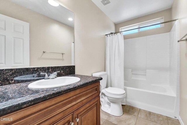 17717 Bangor Ave, Hesperia, CA 92345 - full bath with toilet, tile patterned flooring, vanity, and shower / tub combo with curtain