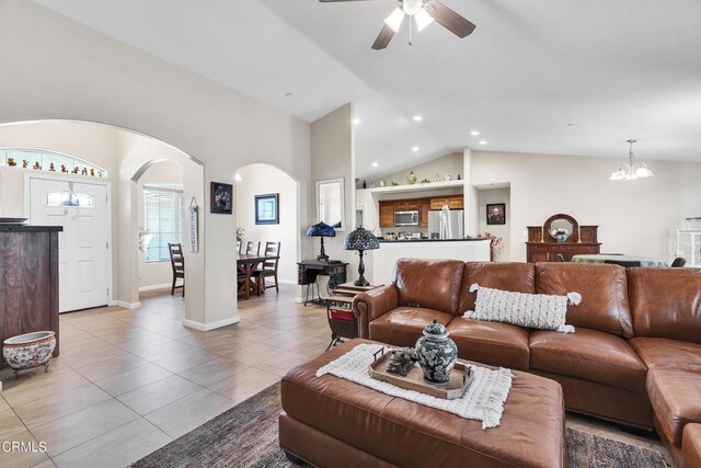 17717 Bangor Ave, Hesperia, CA 92345 - living area with arched walkways, vaulted ceiling, light tile patterned flooring, a ceiling fan, and recessed lighting