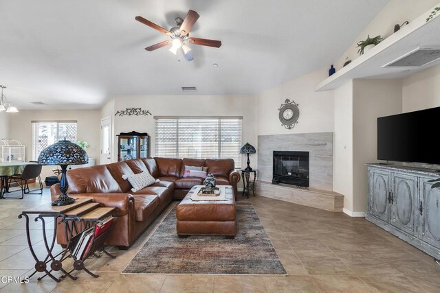 17717 Bangor Ave, Hesperia, CA 92345 - living room featuring ceiling fan, a high end fireplace, and light tile patterned flooring