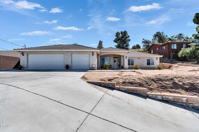 17717 Bangor Ave, Hesperia, CA 92345 - ranch-style house featuring concrete driveway, a garage, stucco siding, and a tile roof