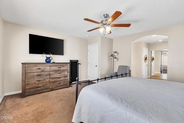 17717 Bangor Ave, Hesperia, CA 92345 - carpeted bedroom featuring arched walkways, baseboards, and ceiling fan