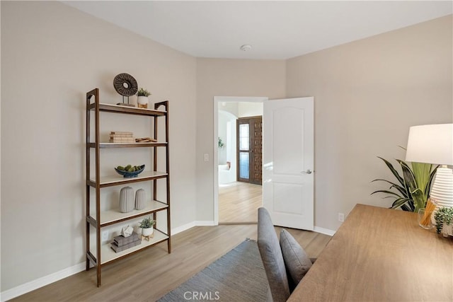 home office featuring light wood-style floors and baseboards