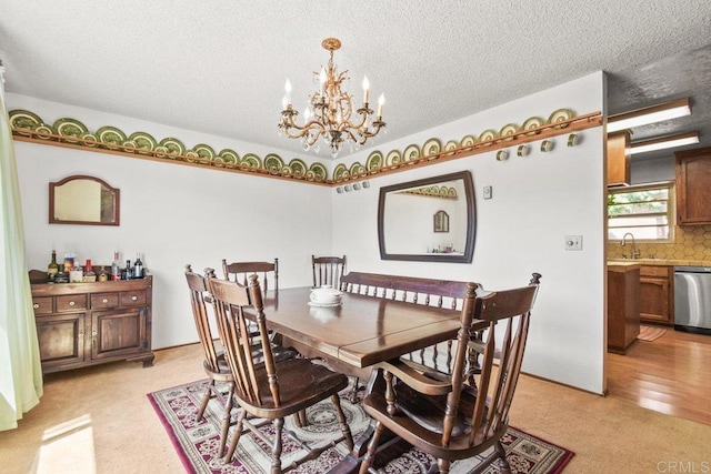 dining space with a textured ceiling and an inviting chandelier