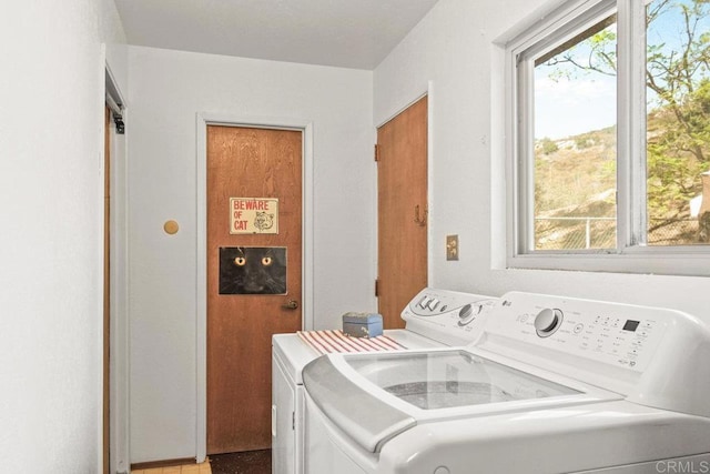 laundry room featuring washer and dryer and laundry area