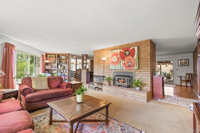 carpeted living room with a wood stove and a textured ceiling