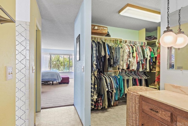 spacious closet featuring light floors