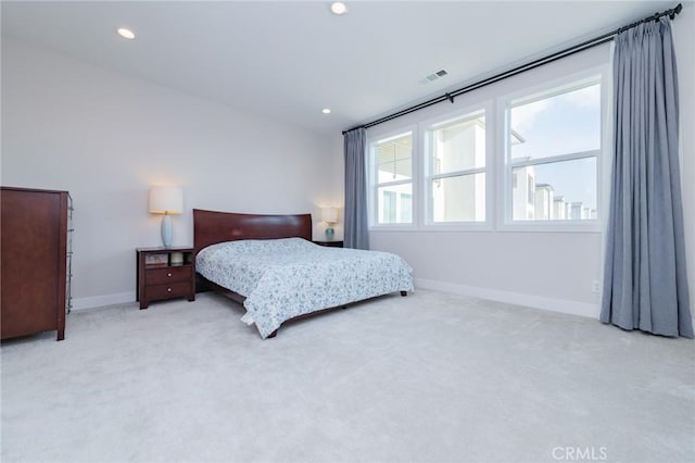 carpeted bedroom with recessed lighting, visible vents, and baseboards