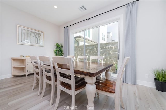 dining room featuring recessed lighting, light wood-type flooring, visible vents, and baseboards