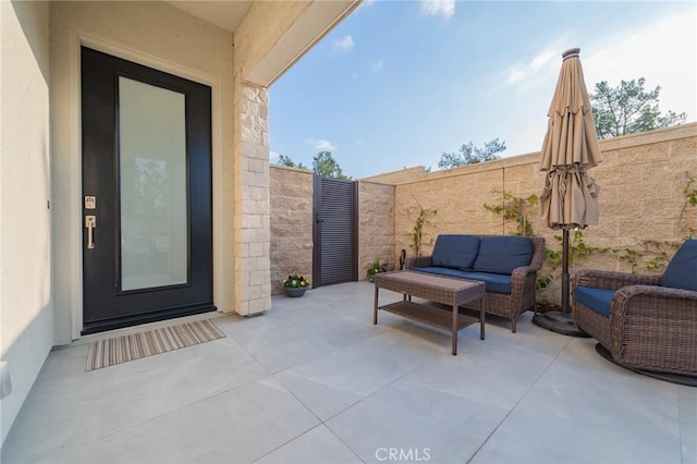 view of patio featuring a fenced backyard and an outdoor living space