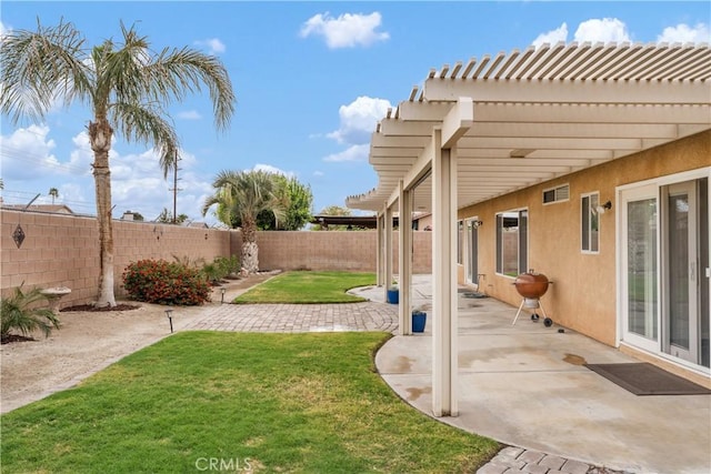 view of yard with a patio area, a pergola, and a fenced backyard