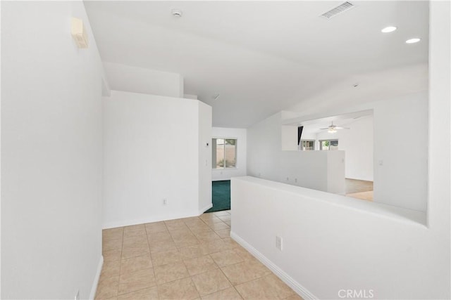 unfurnished room featuring visible vents, baseboards, lofted ceiling, recessed lighting, and tile patterned floors