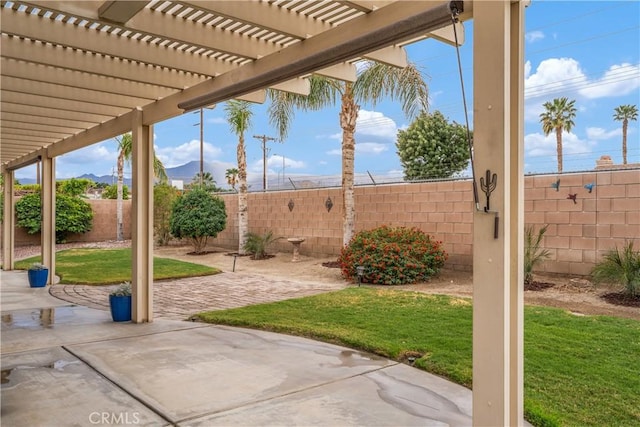 view of patio featuring a fenced backyard and a pergola