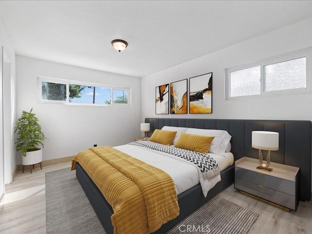 bedroom featuring light wood-type flooring