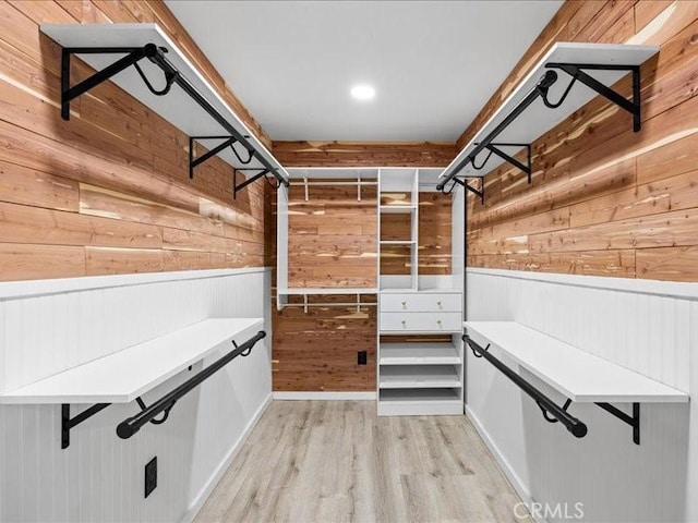 spacious closet featuring light wood-type flooring