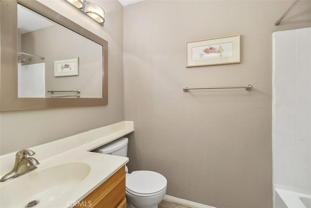 full bath featuring bathtub / shower combination, baseboards, vanity, and toilet