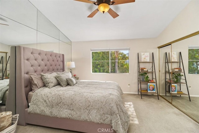 bedroom with lofted ceiling, ceiling fan, carpet, and baseboards