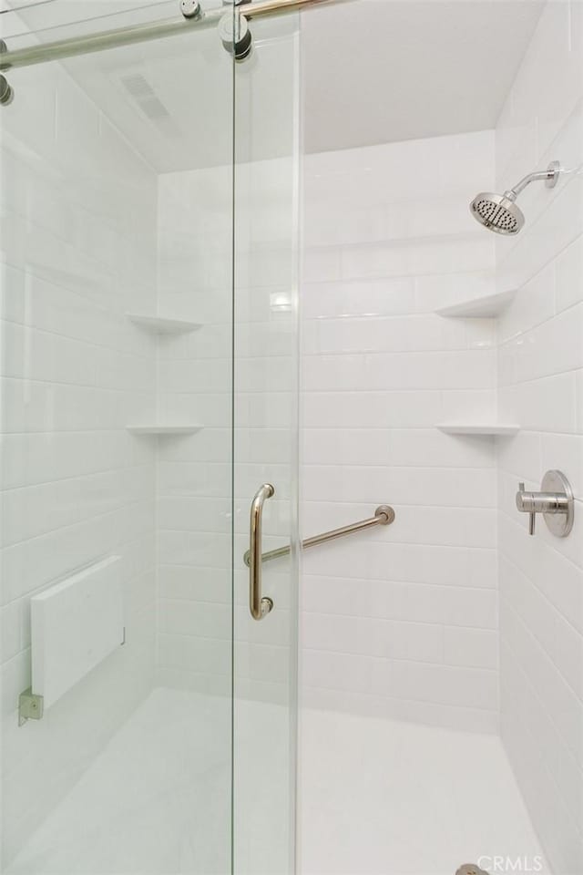 bathroom with a shower stall