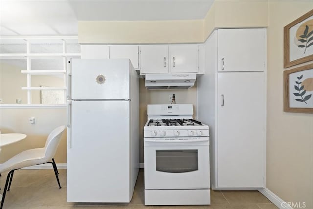 kitchen featuring white cabinetry, light tile patterned flooring, white appliances, under cabinet range hood, and baseboards