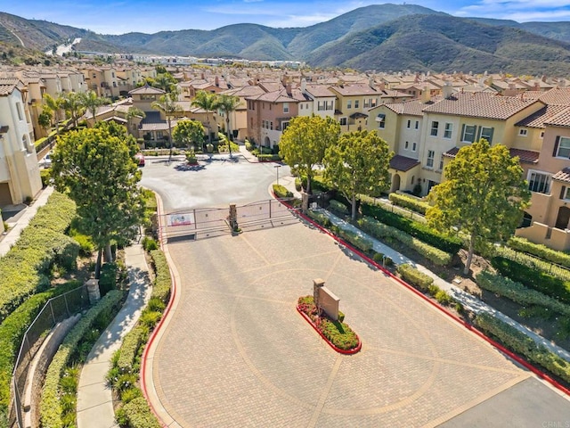 birds eye view of property featuring a mountain view and a residential view