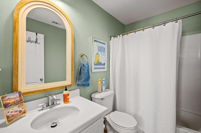 full bath with toilet, visible vents, shower / tub combo with curtain, and vanity