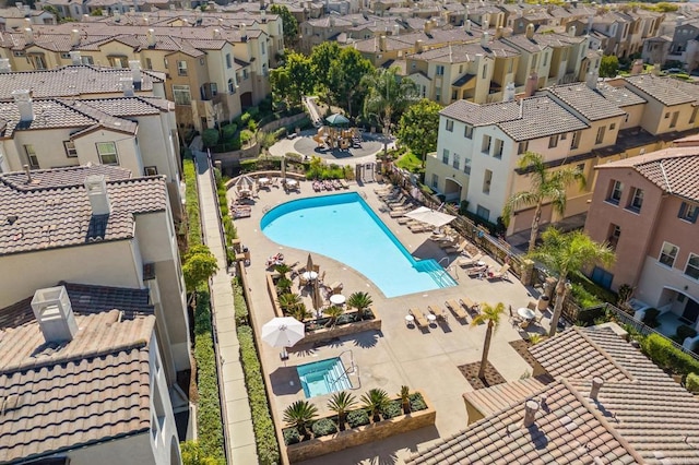 birds eye view of property with a residential view